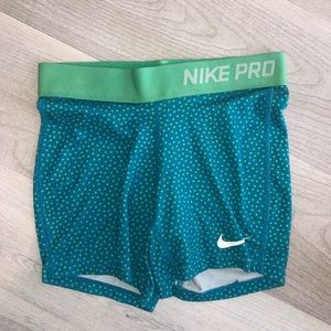 teal and green polka dotted youth nike pros